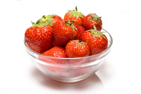 Bowl of strawberries on a white background の写真素材
