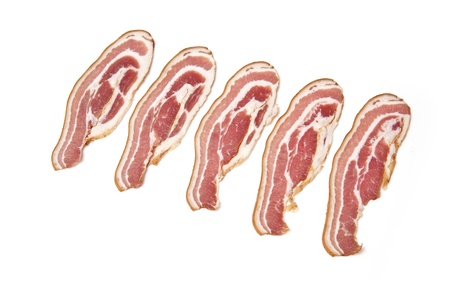 Smoked bacon rashers isolated on white の写真素材