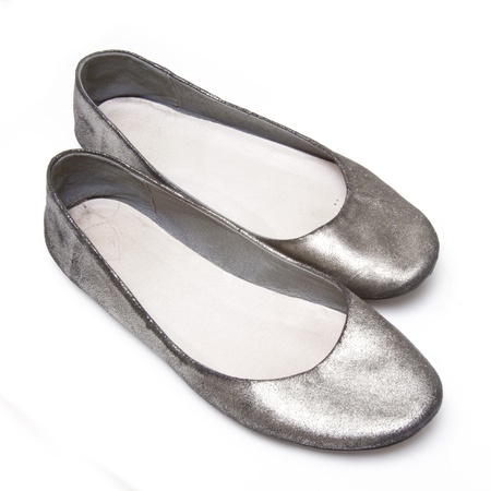 ladies flat shoes isolated on a white studio backgroundの写真素材