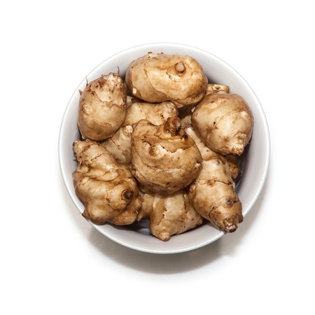 Jersalem Artichoke (Helianthus tuberosus) vegetable isolated on a white studio background.