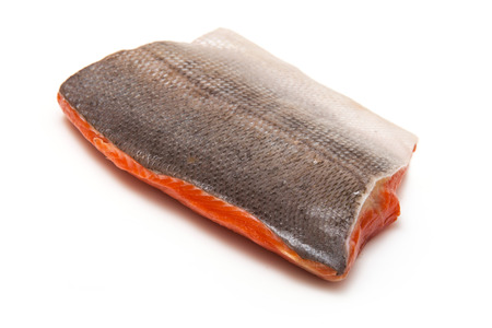 Wild Alaskan Sockeye or Coho Salmon fillet isolated on a white studio background.