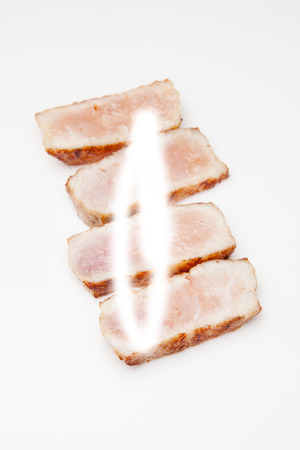 Cooked crocodile meat isolated on a white studio background.の写真素材