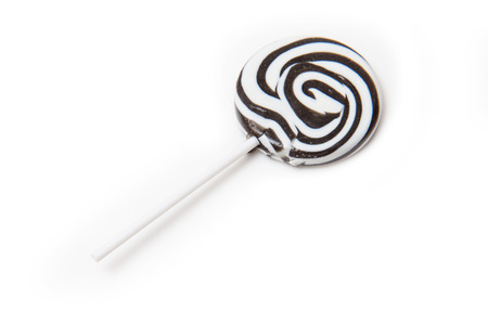 Zebra black and white striped lollypop isolated on a white studio background.の写真素材