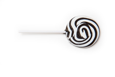 Zebra black and white striped lollypop isolated on a white studio background.の写真素材