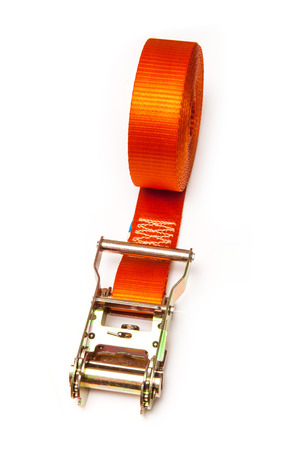Orange rachet strap isolated on a white studio background.の写真素材