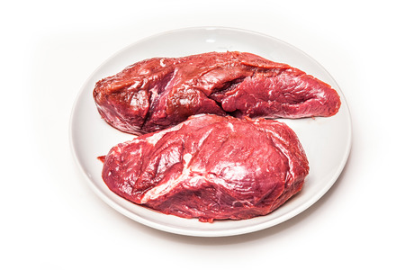 Uncooked Kangaroo meat steaks isolated on a white studio background.の写真素材