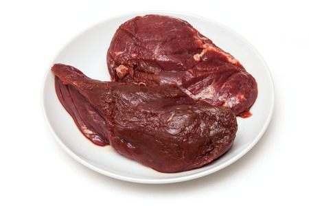 Uncooked Kangaroo meat steaks isolated on a white studio background.の写真素材