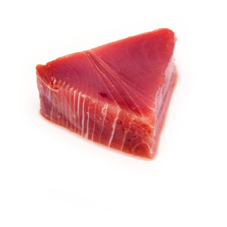 Yellowfin tuna steak isolated ona  white studio background.の写真素材
