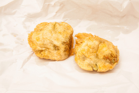 Deep fried Pea fritters or balls fresh from the fish and chip shop.の写真素材
