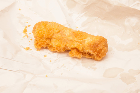 Deep fried sausage fresh from the fish and chip shop.の写真素材