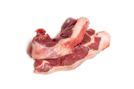 Uncooked goat meat leg steaks isolated on a white studio background.の写真素材