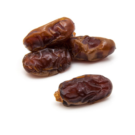 Halawi dates isolated on a white background.  Halawi dates originate from date trees in the deserts and farms of Iraq. Halawi means "sweet" in Arabicの写真素材
