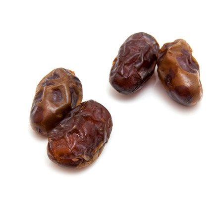 Halawi dates isolated on a white background.