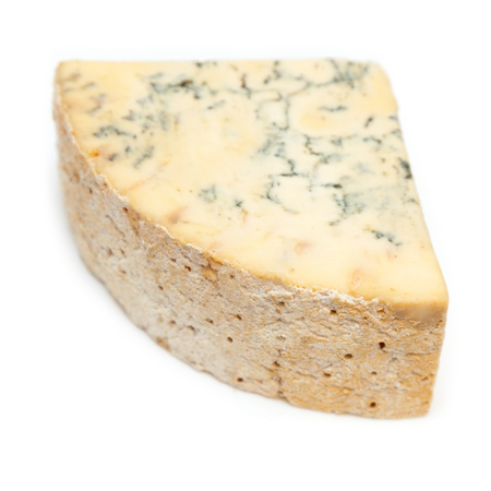 Mature blue stilton cheese isolated on a white studio background.の写真素材