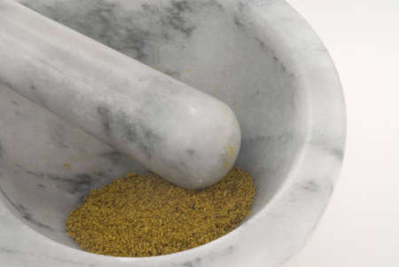 mortar and pestle with ground curryの写真素材