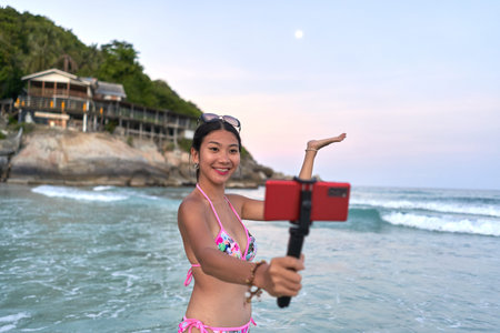 Streamer showing the moon while performing live during the Full moon party