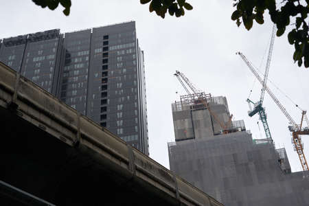 cranes building skyscrapers in the city