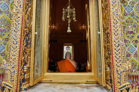 Bangkok, Thailand, february, 16, 2022: open window of a buddhist temple with a monk inside