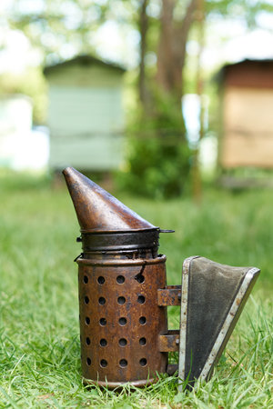 Traditional tool to scare the bees with smoke in a honey production farm