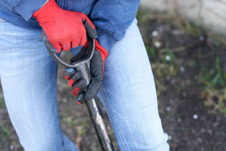 Person ploughing the land of a farmの写真素材