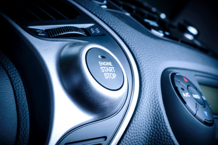 START STOP ignition button in car, vehicle with visible fragment of instrument panel in vehicle...