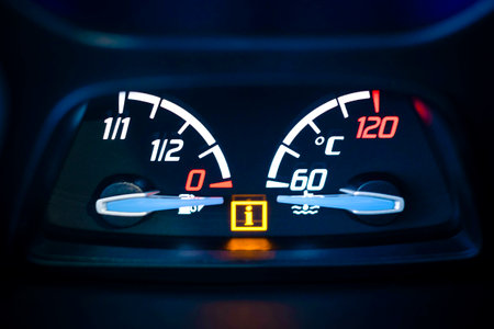 Car, vehicle interior with visible Fuel, gas gauge and Engine coolant temperature gauge with illuminated Information warning lamp visible の写真素材