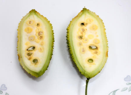 teasel gourd, Kakrol, Momordica Momordica subangulata subsp renigera syn renigera, a perennial vine with undivided to 3 to 5-lobed leaves, white to yellow flowers with spotted base The fruit is ovoid, 5-7 cm long with flattened spines  の写真素材