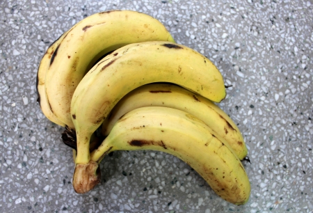 Banana, plantain, French plantain, Kela, Musa x paradisiaca, yellow cylindrical fruit, a berry with rind enclosing white pulp, table fruit, young green fruits cooked as vegetable の写真素材
