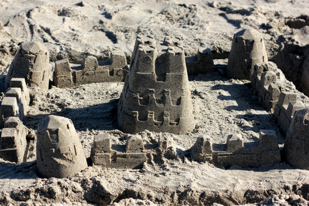 Sand castle on Natural Bridges Beach, beautifully crafted by children playing around on the beachの写真素材