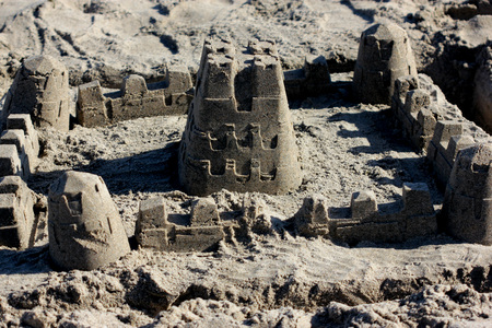 Sand castle on Natural Bridges Beach, beautifully crafted by children playing around on the beachの写真素材