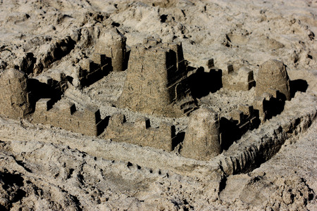 Sand castle on Natural Bridges Beach, beautifully crafted by children playing around on the beachの写真素材