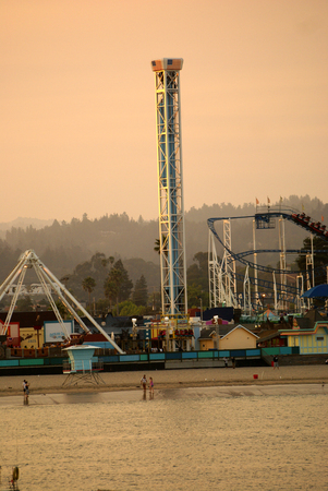 Santa Cruz Bay area in California, USA, thronged by visitors with parked boats and ships, majestic buildings, rows of palms and play areas.のeditorial素材