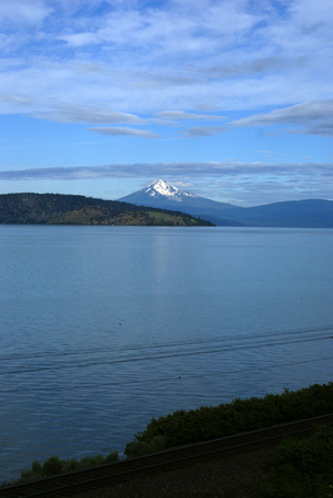 Upper Klamath Lake, shallow freshwater lake east of Cascade Range in south-central Oregon, USA , rich in fish, blue green algae, snow covered peak of Mt. McLoughlin in background.の写真素材