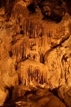 Shasta Lake Caverns, California, network of caves, chain of stairs, limestone deposits forming stalactites, stalagmites, soda straws, columns, flowstone, mostly hanging like small rods.の写真素材