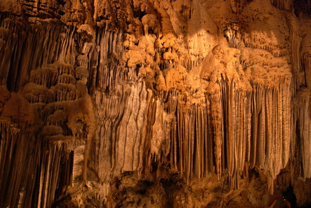 Shasta Lake Caverns, California, network of caves, chain of stairs, limestone deposits forming stalactites, stalagmites, soda straws, columns, flowstone, mostly hanging like small rods.の写真素材