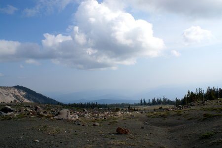 Shasta mountain Range, California, USA, with rugged terrains, frequented by tourists and climbers, snow covered peaks and dense clouds above.の写真素材