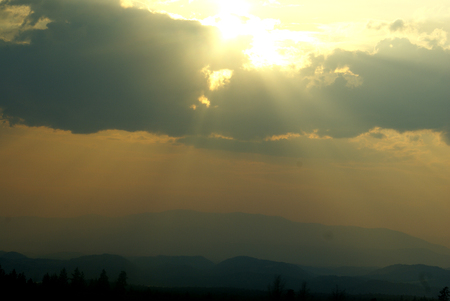 Shasta mountain range, California, USA with dense orange yellow and nearly black clouds above mountains.の写真素材
