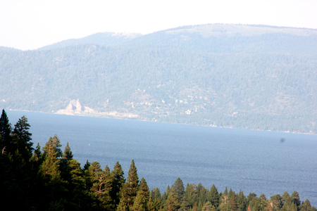 Emerald Bay on California side of Lake Tahoe on west shore, USA, National Natural Landmark with Eagle Falls trails and Fannette Island in the middle with few conifers and remains of Tea House on top.の写真素材