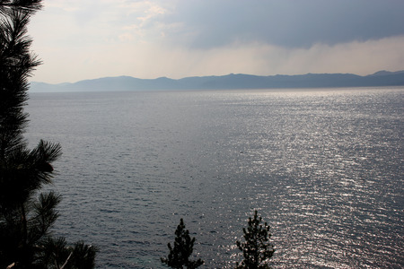 Lake Tahoe, distributed between Nevada and California, one of the largest and deepest lakes in USA, with popular spots for water and hiking activities.の写真素材