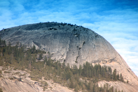 Evening view of North Dome, Yosemite National Park, California, zoomed in view from Curry Village just after the last rays of Sun left the peaks, a granite rock, southernmost summit of Indian Ridge.の写真素材