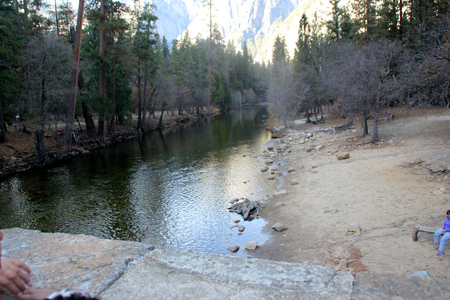 Portion of Mirror Lake, Yosemite National Park, California, slowly passing into mountain stream. Favorite tourist spot, clear water providing mirror image of mountain peaks above.の写真素材