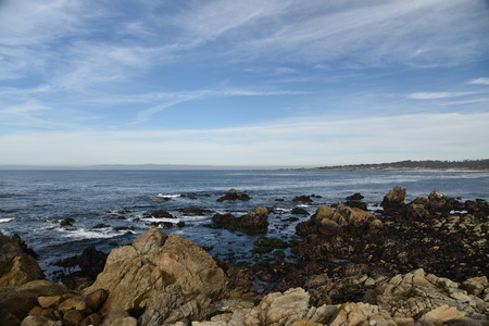Point Joe, Pebble Beach, 17 Mile Drive, California, USA, scenic point with large rocks, providing pleasant view of surfing sea, whales and migratory birds.の写真素材