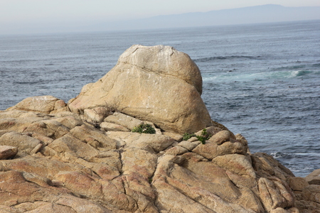 Point Joe, Pebble Beach, 17 Mile Drive, California, USA, scenic point with large rocks, providing pleasant view of surfing sea, whales and migratory birds.の写真素材