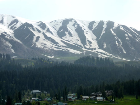Apharwat Mountain slopes seen from Gulmarg, Kashmir, snowing melting from lower slopes, a favorite tourist destination.の写真素材