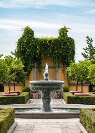 Berlin, Germany - August 9, 2021: Gardens of the World (Garden of the World). Italian part of the garden with a fountain, trees and bushes.のeditorial素材