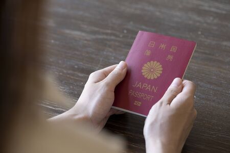 Young woman hand holding passportの写真素材