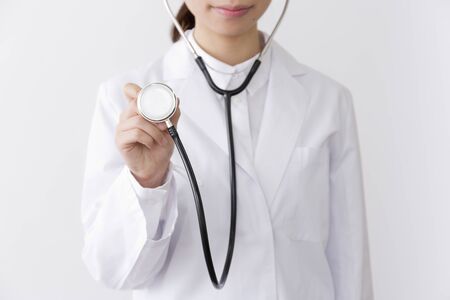 Woman in white coatの写真素材