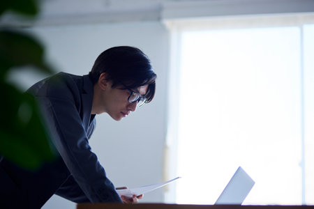 Japan businessman working in officeの写真素材