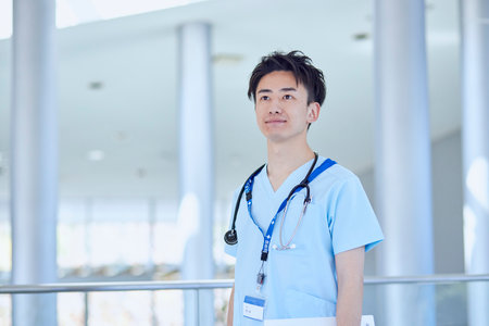 Male doctor working in hospitalの写真素材