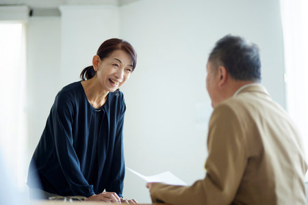 Japan senior woman having a meeting in the officeの写真素材